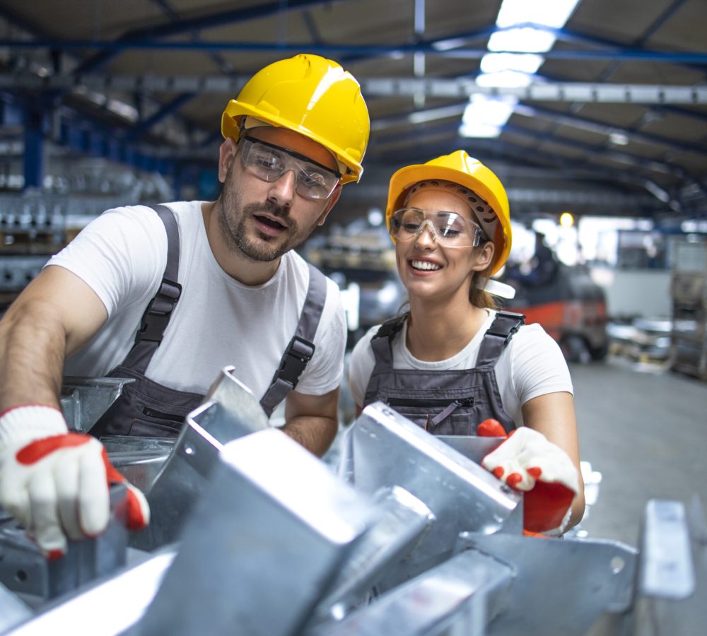 Factory workers working in production line.